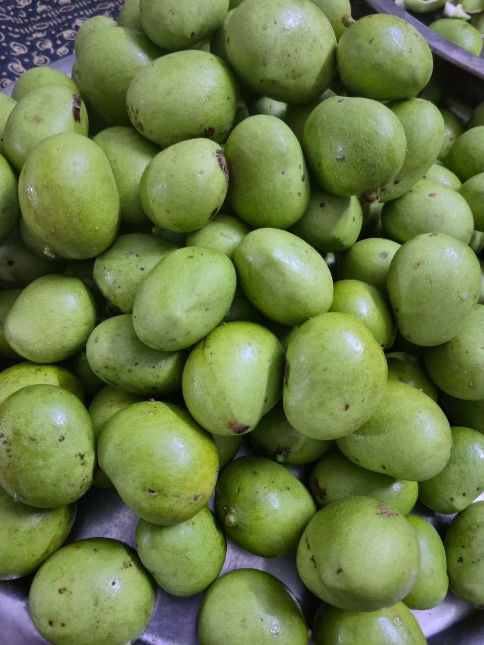 Mangoes cleaned and cut for the pickle process